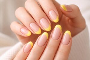 Brightening Elegance: The Trendy Yellow French Tip Manicure